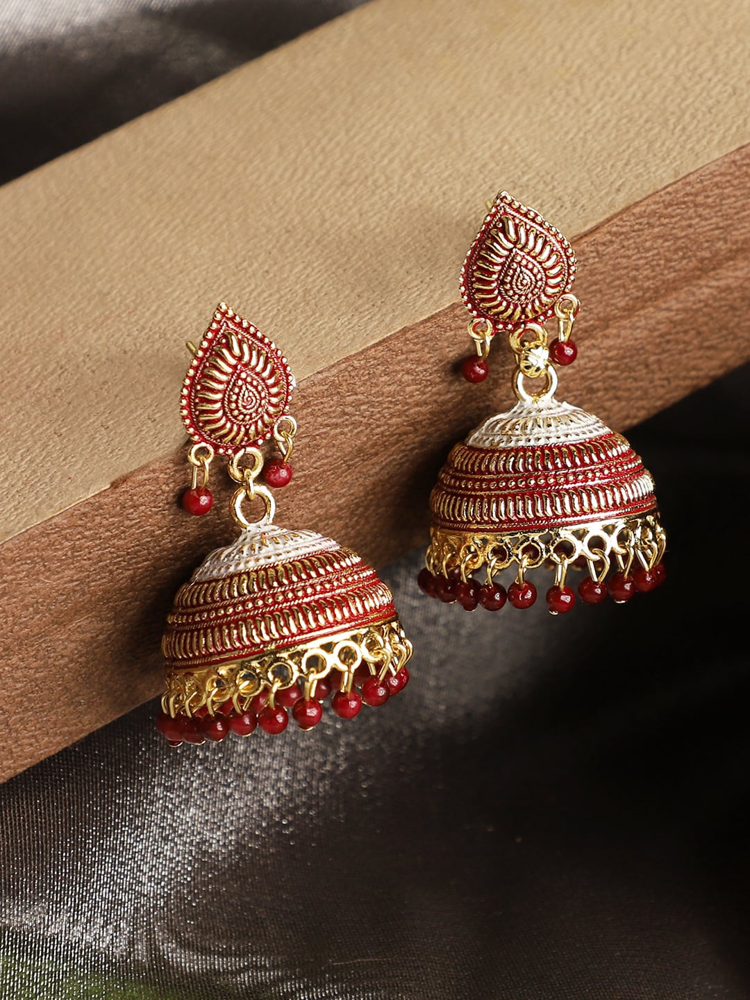 

ANIKAS CREATION Maroon & Gold-Toned Dome Shaped Jhumkas