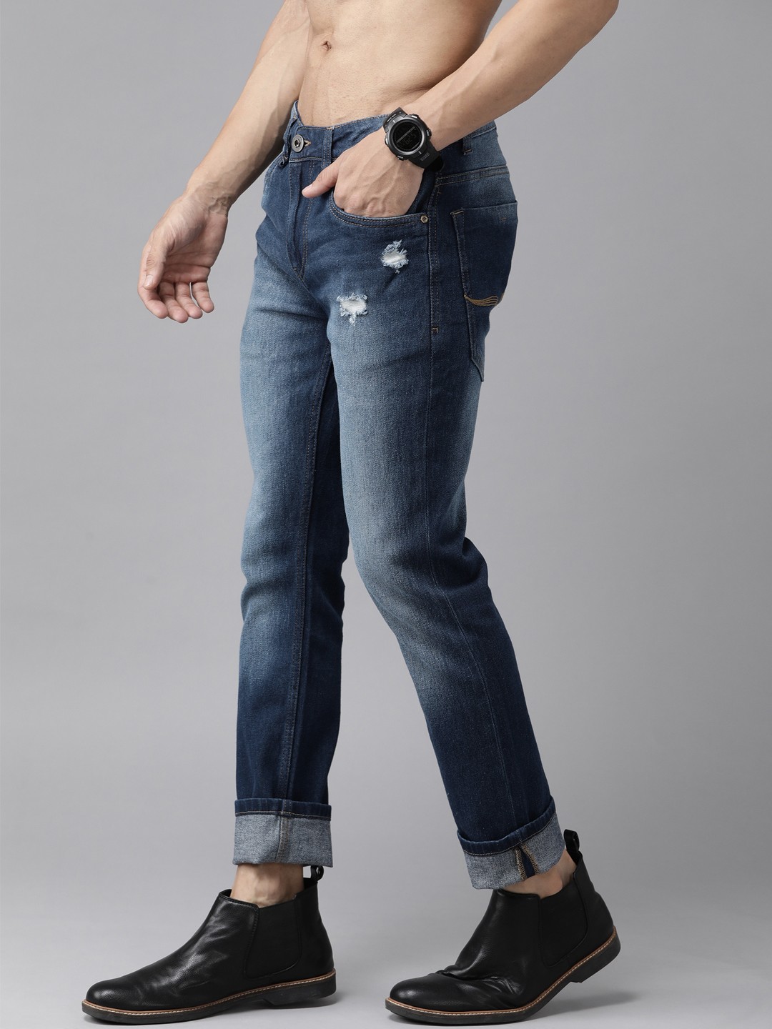 

Roadster Men Navy Blue Skinny Fit Mildly Distressed Heavy Fade Stretchable Jeans
