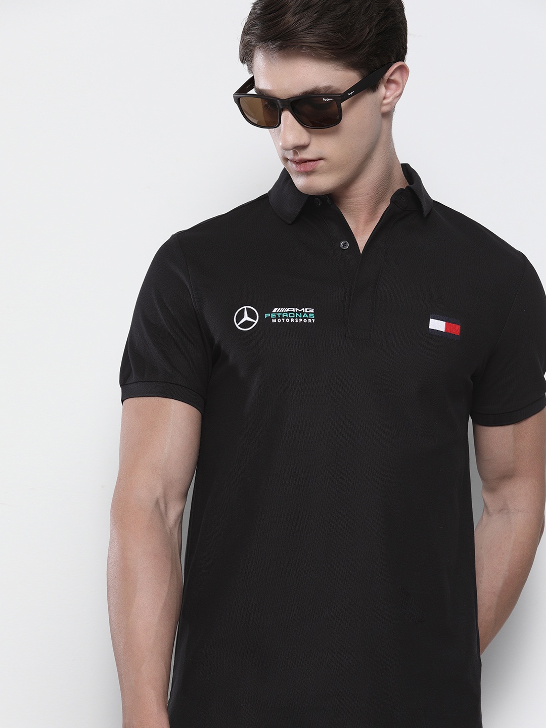 

Tommy Hilfiger Men Black Solid Polo Collar Pure Cotton T-shirt