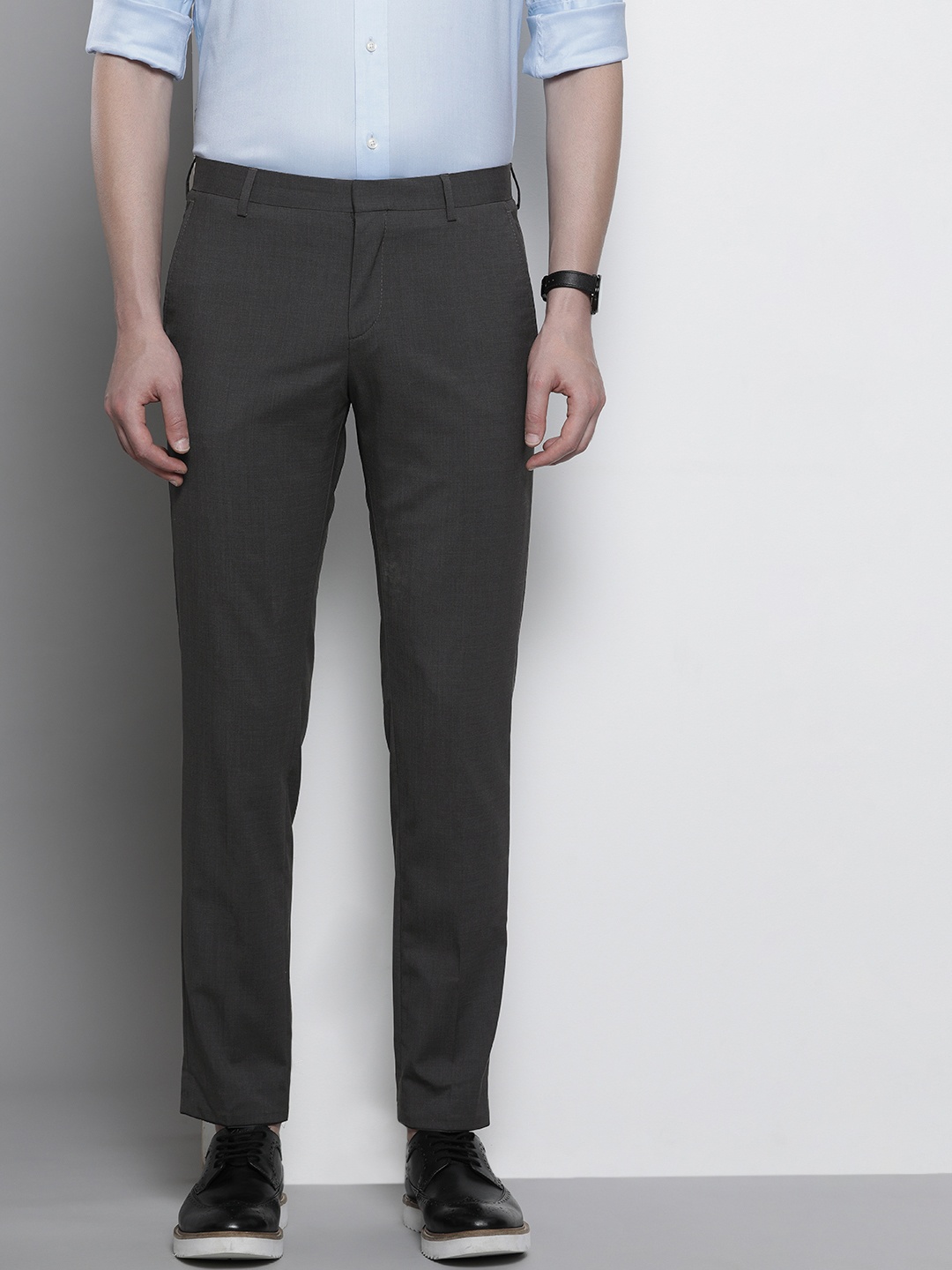 

Tommy Hilfiger Men Charcoal Grey Solid Regular Trousers