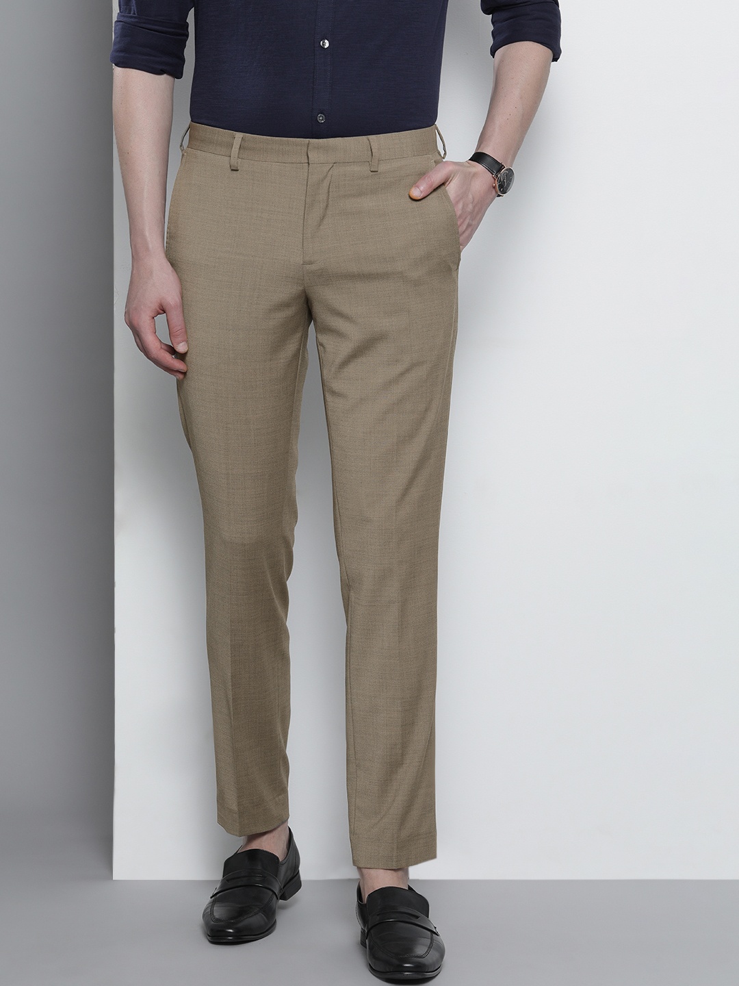 

Tommy Hilfiger Men Beige Slim Fit Solid Regular Trousers