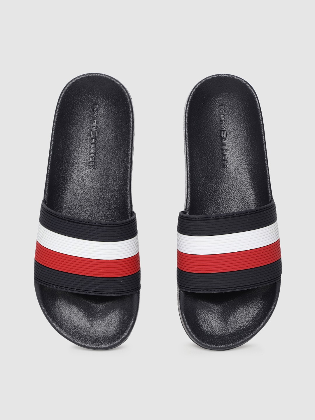 

Tommy Hilfiger Men Navy Blue & Red Striped Sliders