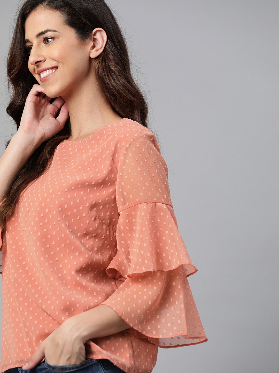 

Mast & Harbour Women Peach Coloured Dobby Self Design Bell Sleeve Regular Top