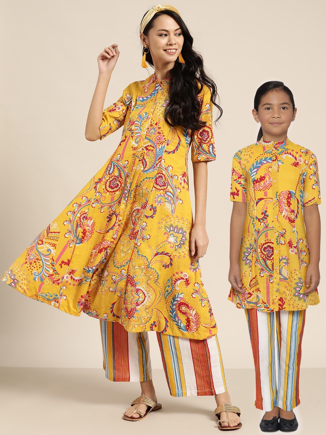 

Sangria Girls Mustard Yellow Ethnic Motifs Print Pure Cotton A-Line Kurta With Trousers