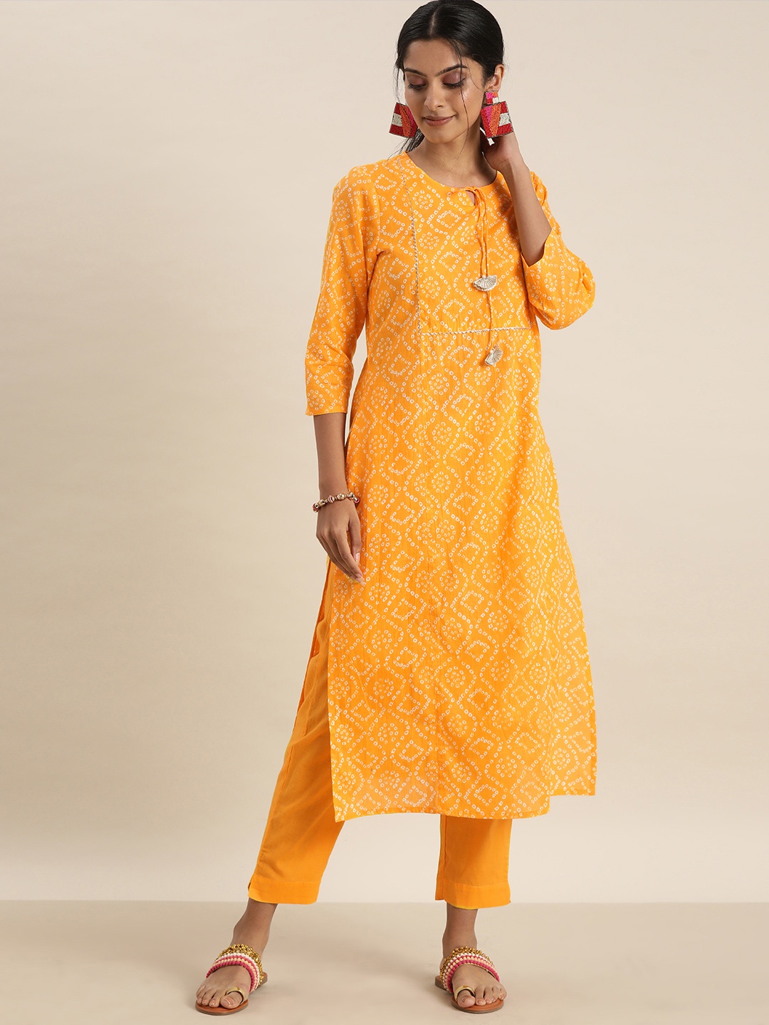

Sangria Women Yellow Bandhani Printed Regular Gotta Patti Pure Cotton Kurta with Trousers