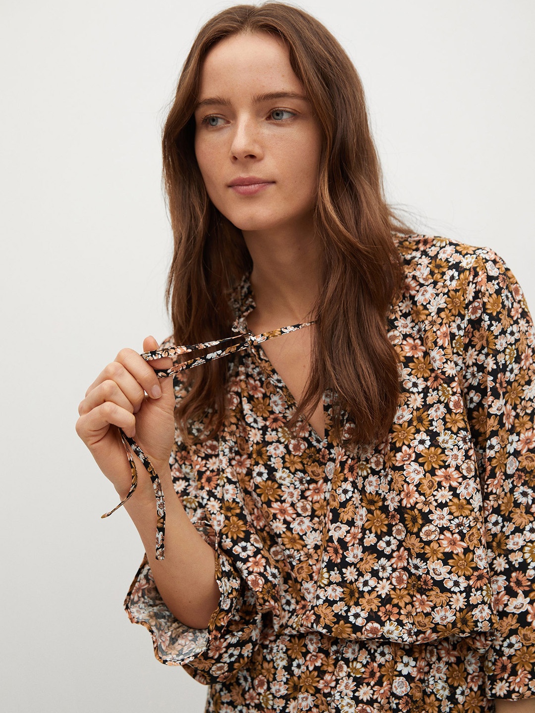 

Mango Black & Off White Floral Printed Tie-up Neck Puff Sleeves Regular Top