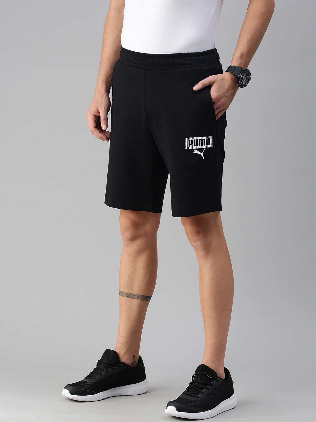 

Puma Men Black Solid Regular Fit Mid-Rise Shorts