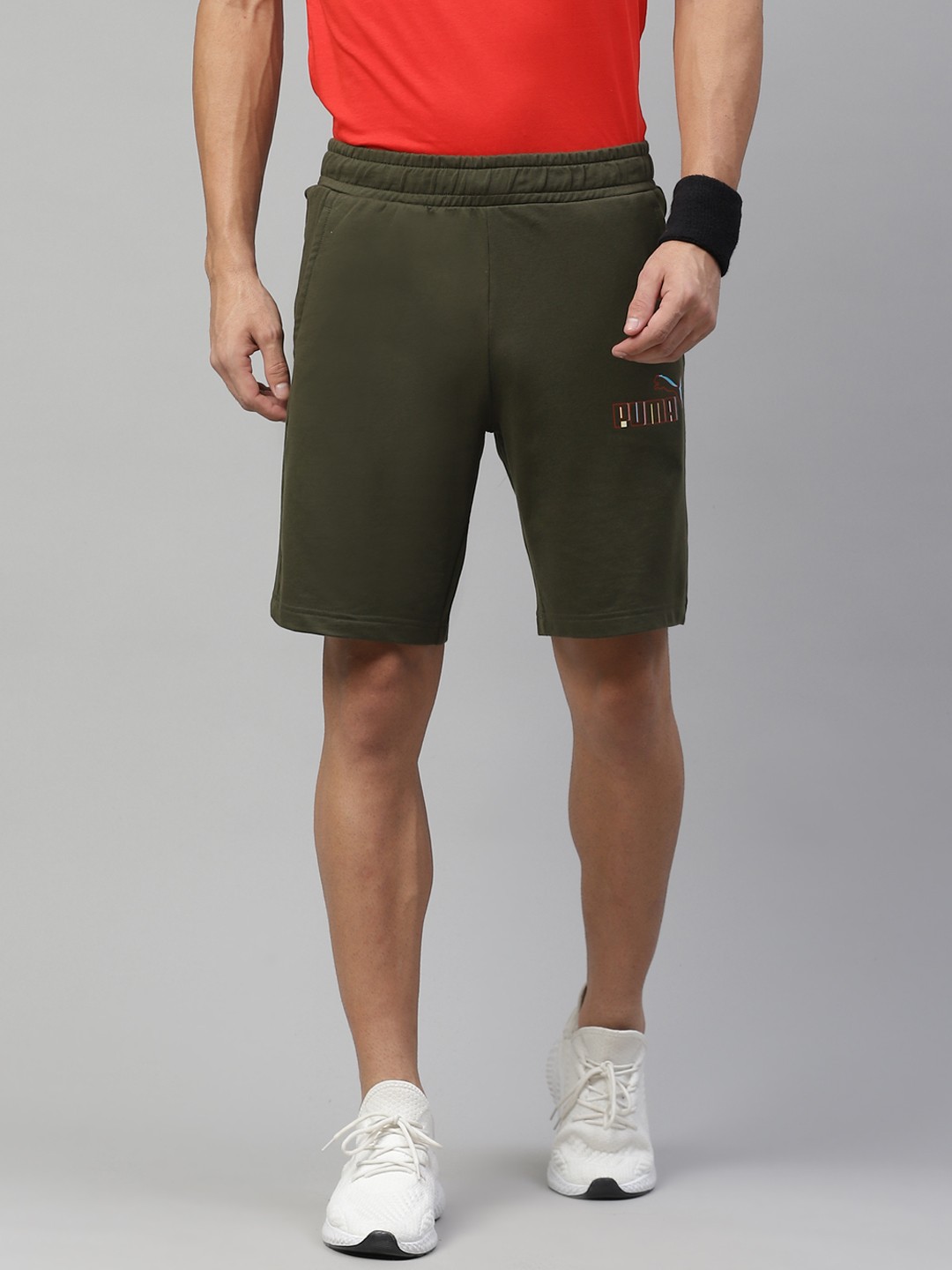 

Puma Men Olive Green Solid Mid-Rise Sports Shorts