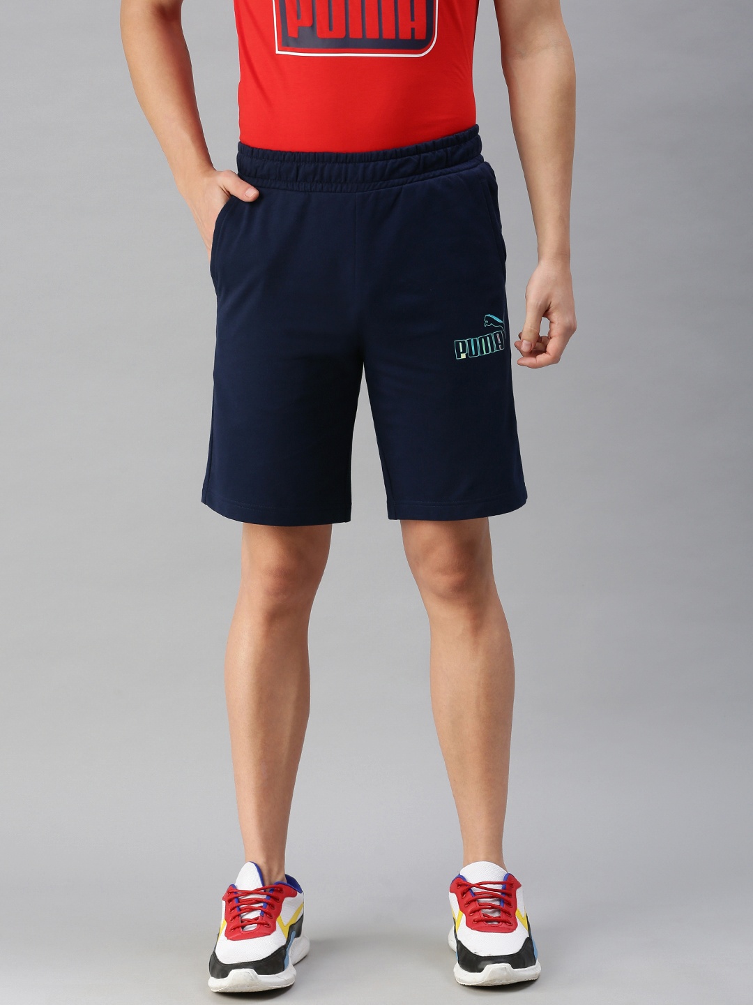 

Puma Men Navy Blue Solid Mid-Rise Sports Shorts