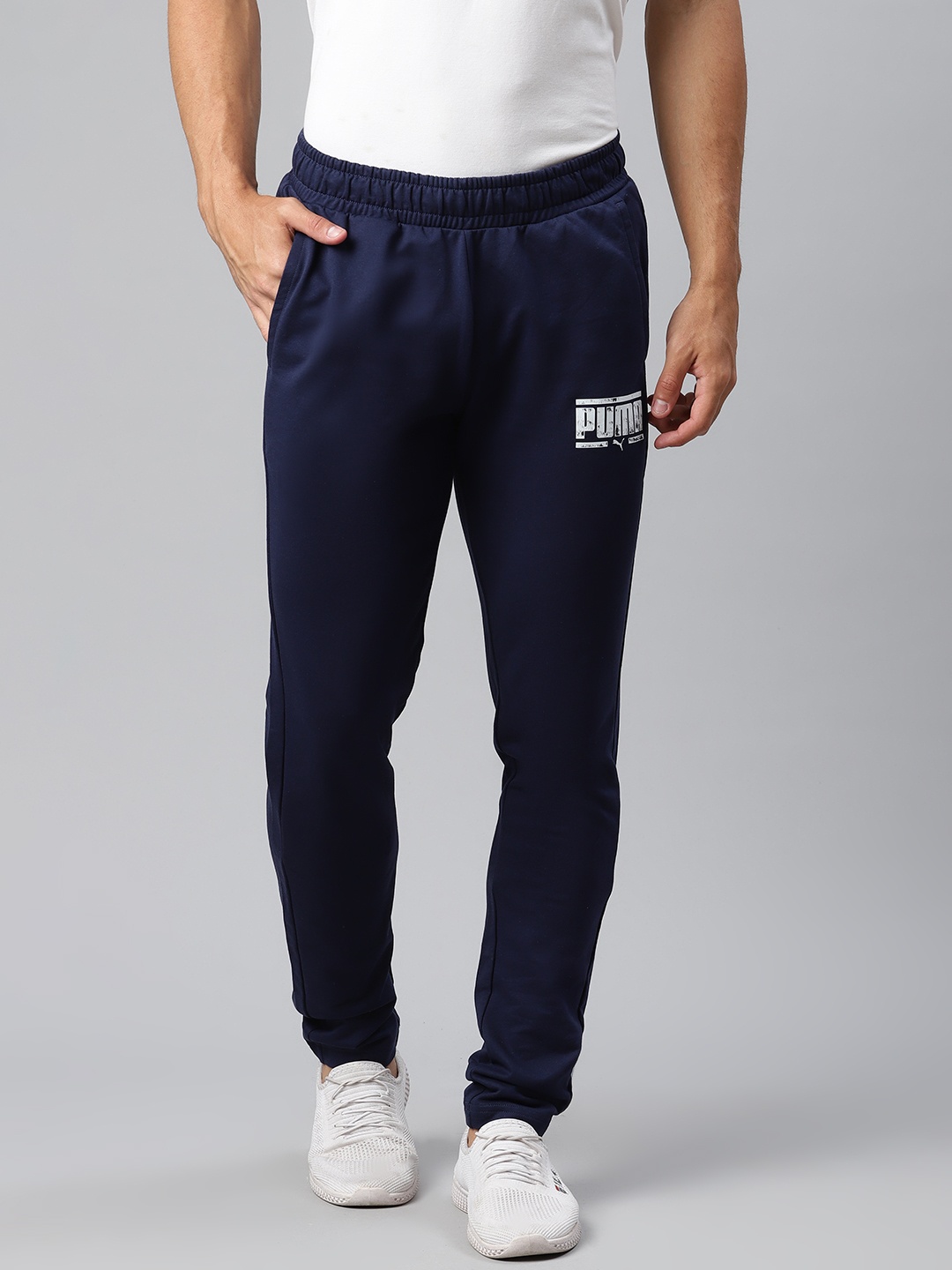 

Puma Men Navy Graphic 13 Solid Slim Fit Track Pants, Navy blue