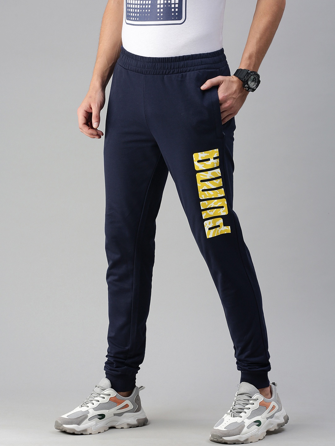 

Puma Men Navy Blue Graphic 13 Peacoat Solid Joggers