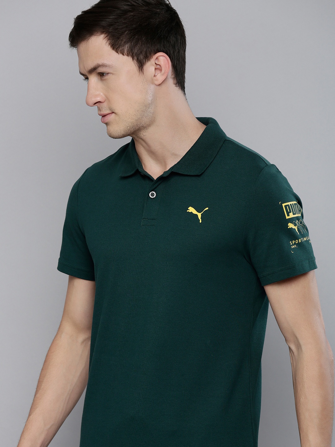 

Puma Men Green Slim Fit Solid Graphic III Polo Collar T-shirt with Printed Detail