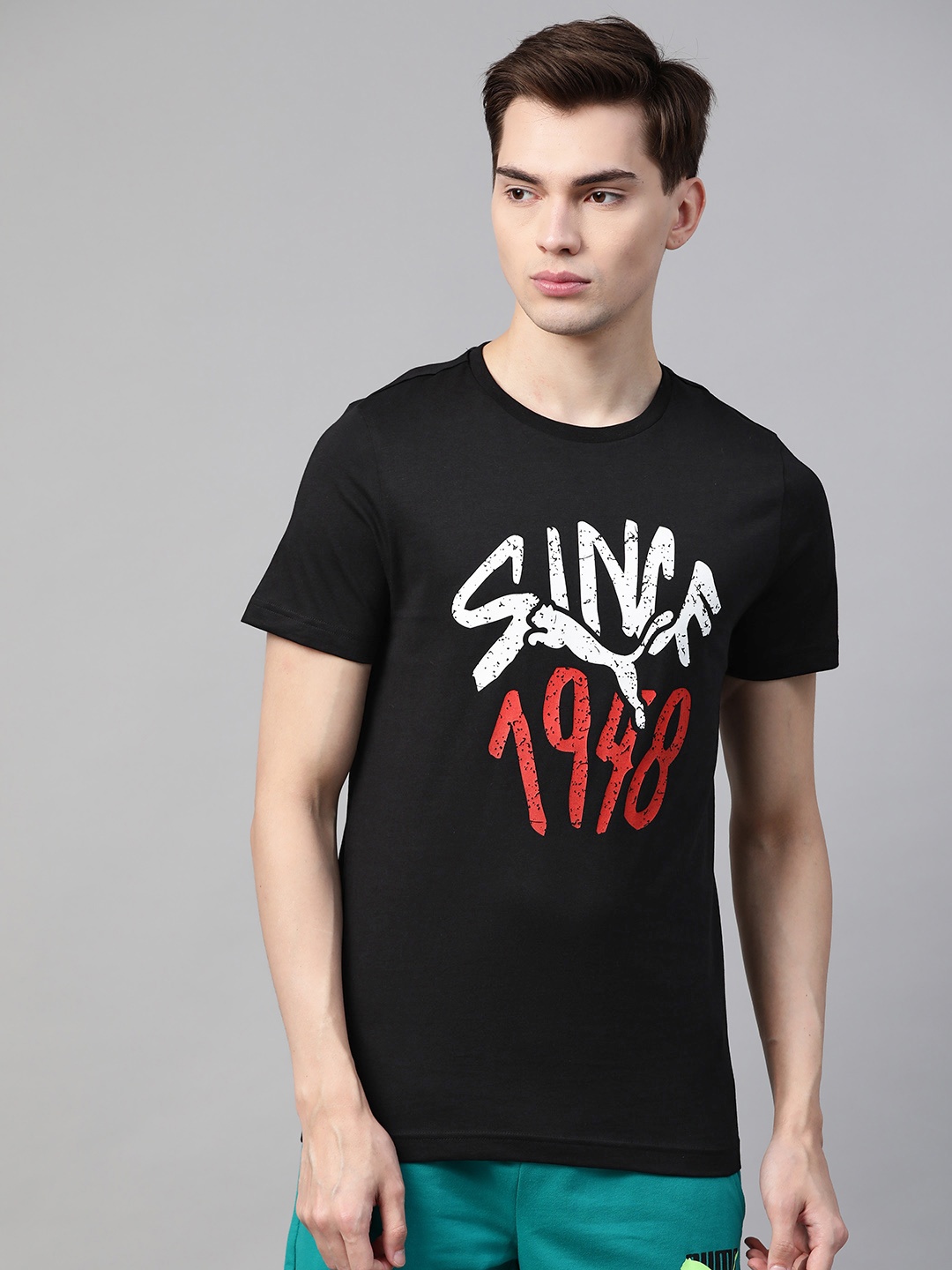 

Puma Men Black & White Pure Cotton Typography Printed Slim Fit T-shirt