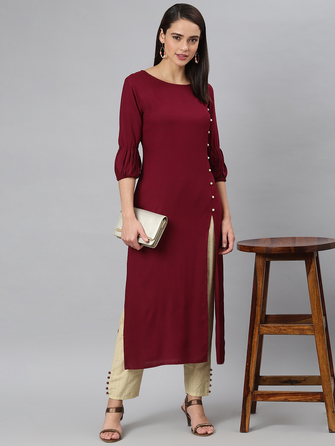

Khushal K Women Maroon Solid Kurta with Palazzos