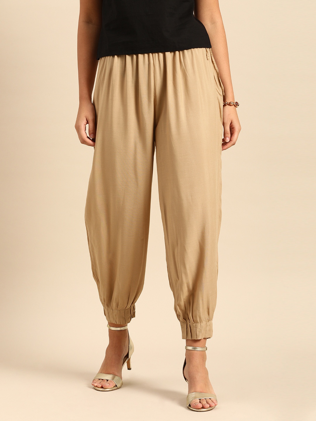 

Varanga Women Beige Loose Solid Anti Fit Trousers