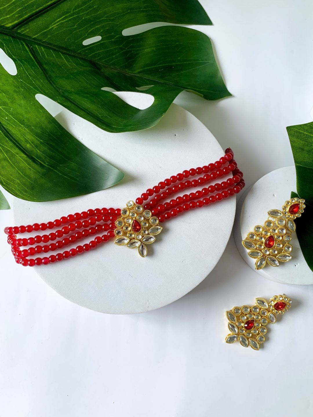 

I Jewels Red Gold Plated Kundan Studded Beaded Choker & Earring Jewellery Set
