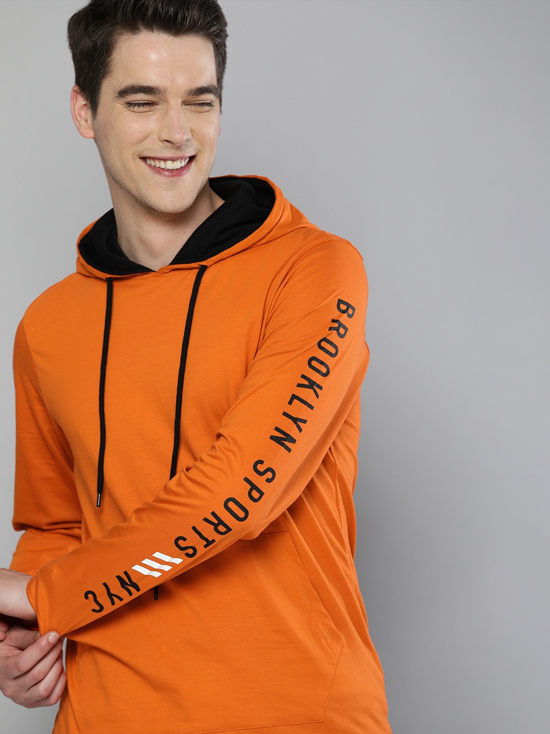 

HERE&NOW Men Orange Solid Hooded Pure Cotton Sweatshirt