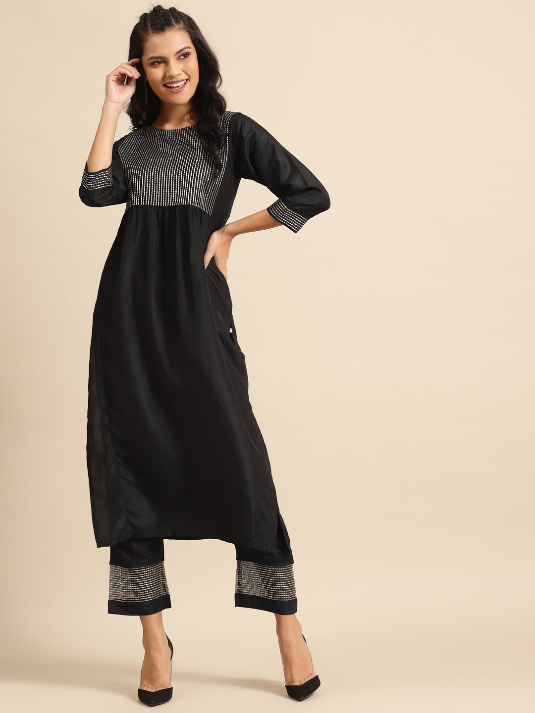 

Varanga Women Black & Golden Embroidered Sequinned Yoke Design Kurta & Trousers