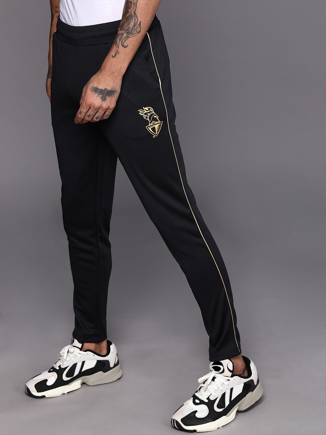 

WROGN ACTIVE Men Black Solid Track Pants with Kolkata Knight Riders Printed Detail