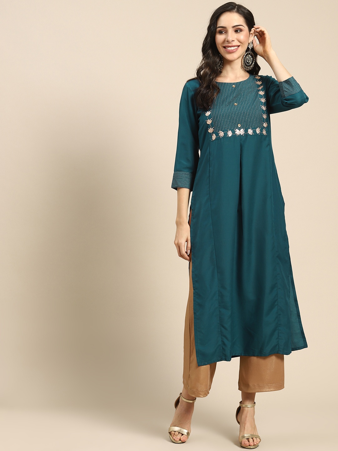 

Varanga Women Teal Green Ethnic Motifs Yoke Design Thread Work Kurta
