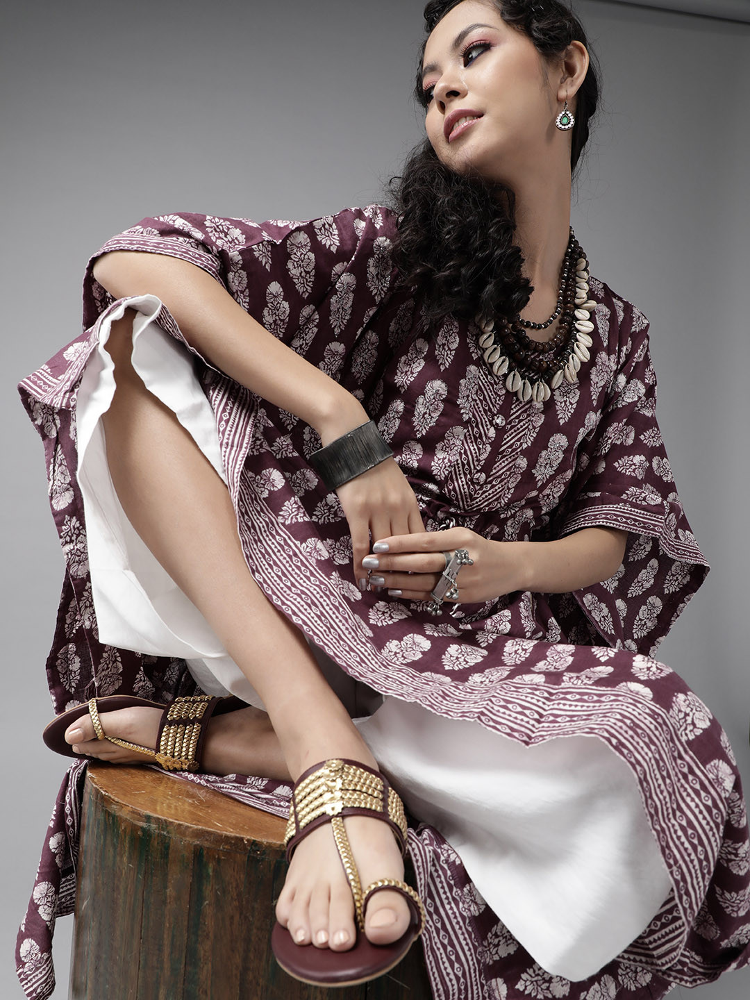 

Ishin Women Burgundy & White Ethnic Motifs Printed Extended Sleeves Asymmetric Kaftan Kurta
