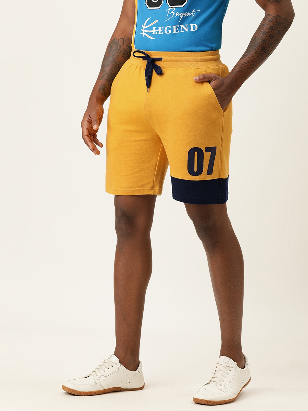

VEIRDO Men Yellow & Navy Blue Typography Printed Mid-Rise Regular Shorts