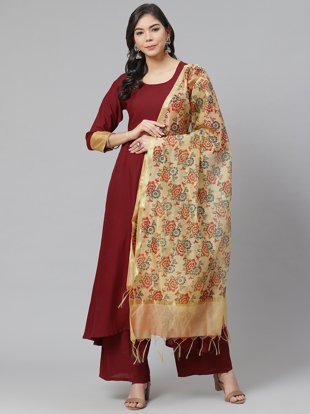 

Ives Women Maroon Solid Kurta with Palazzos & Dupatta