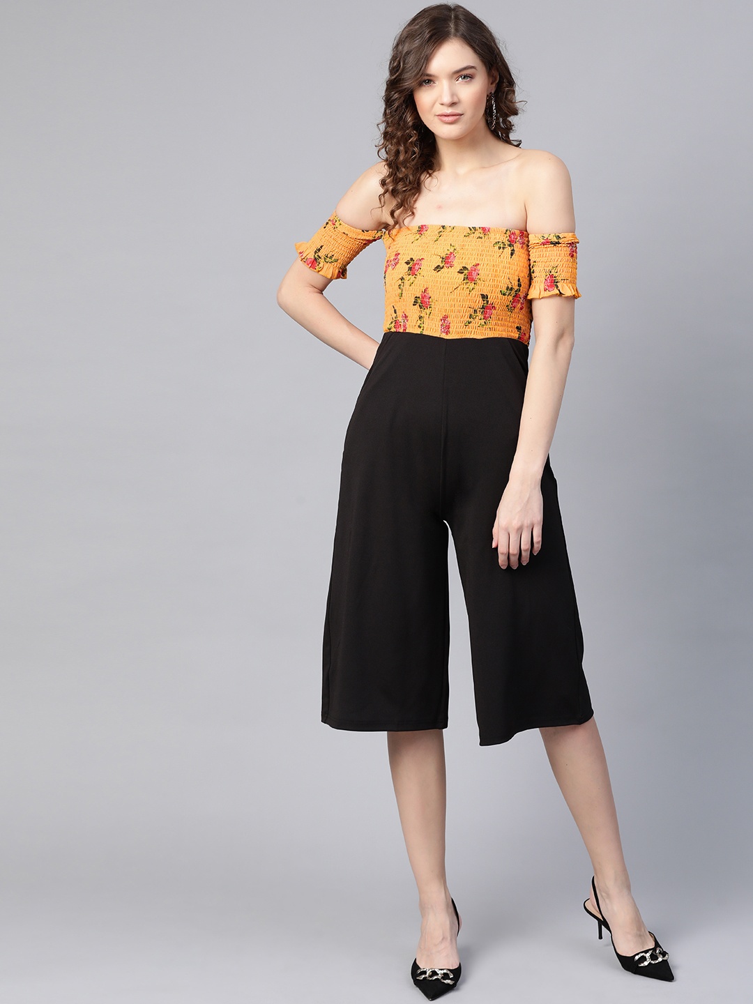 

SASSAFRAS Mustard and Black Floral Print Smocked Jumpsuit