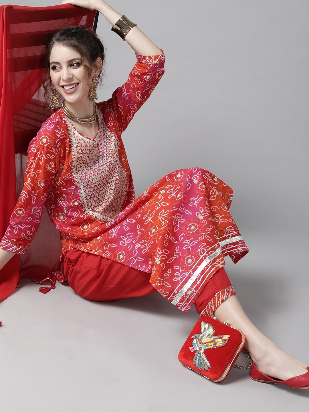 

Ishin Women Red & White Printed Cotton Bandhani Kurta Palazzos & Dupatta with Zari