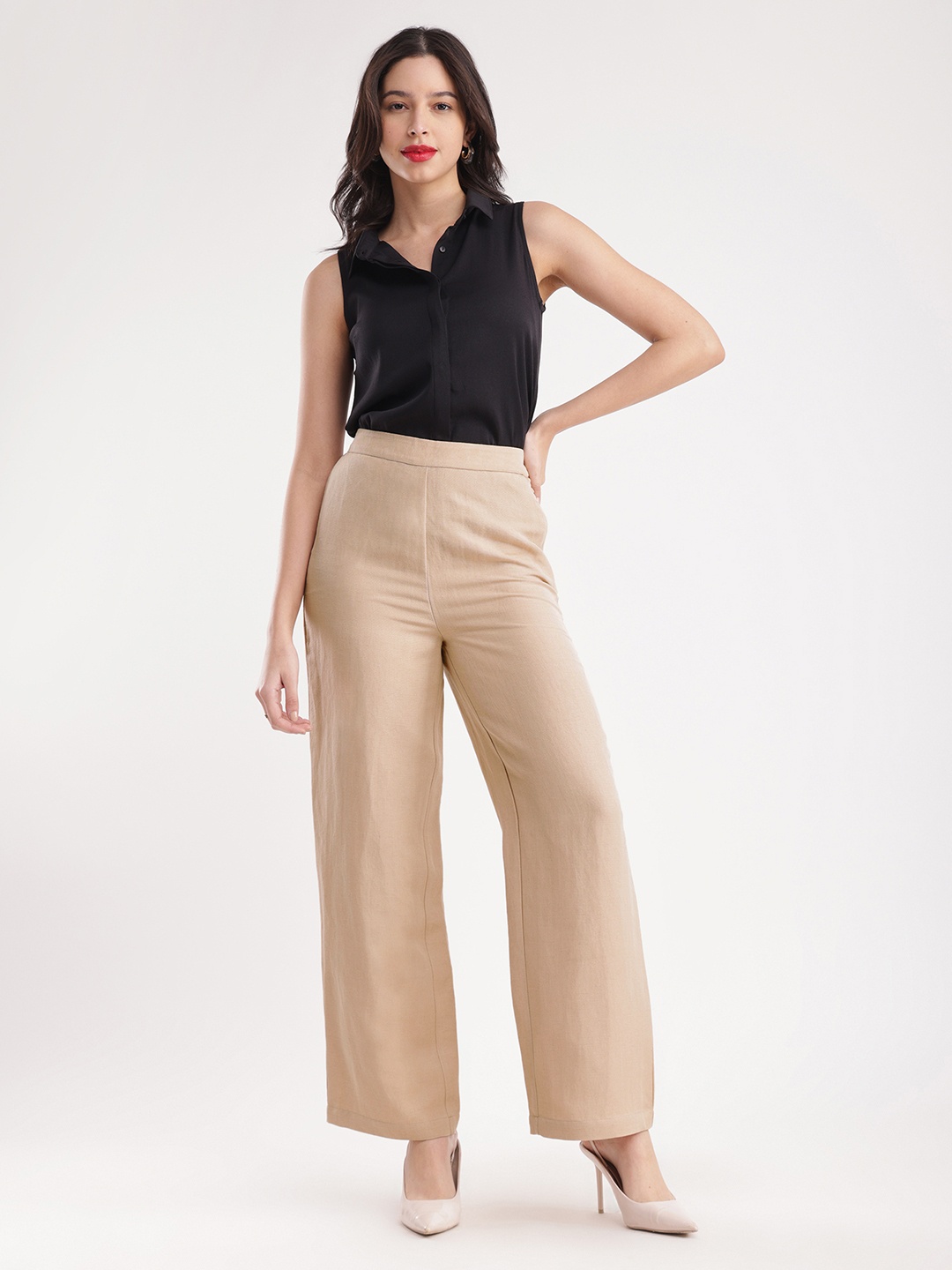 

FableStreet Women Beige Flared Solid Regular Trousers