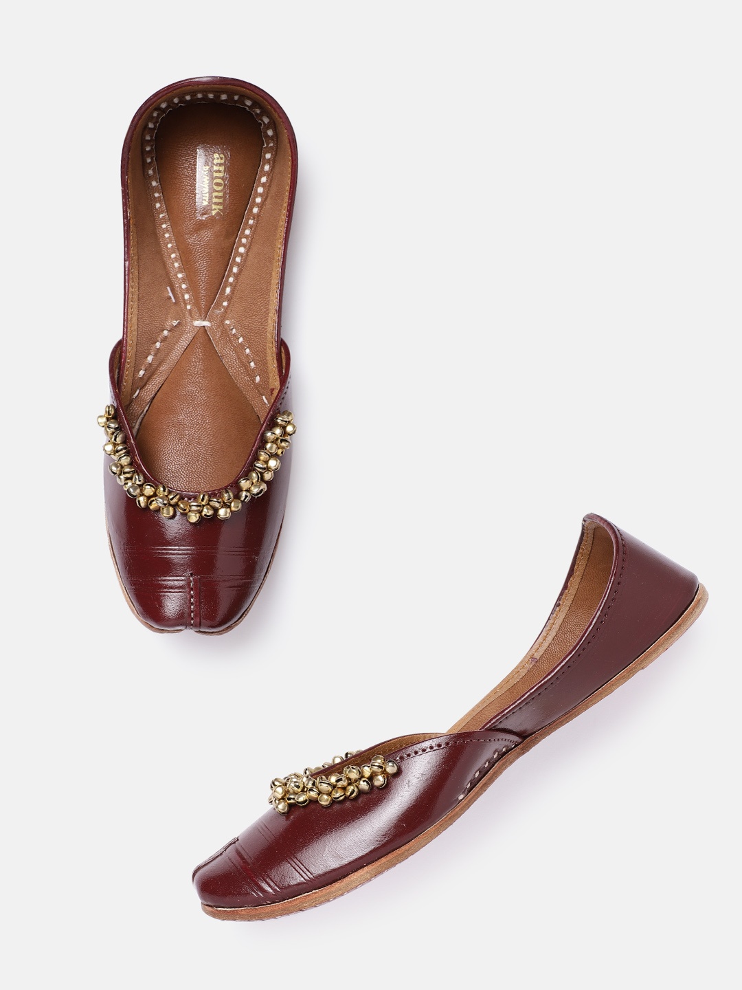 

Anouk Women Burgundy & Gold-Toned Solid Ghungroo Detail Handmade Ethnic Mojaris