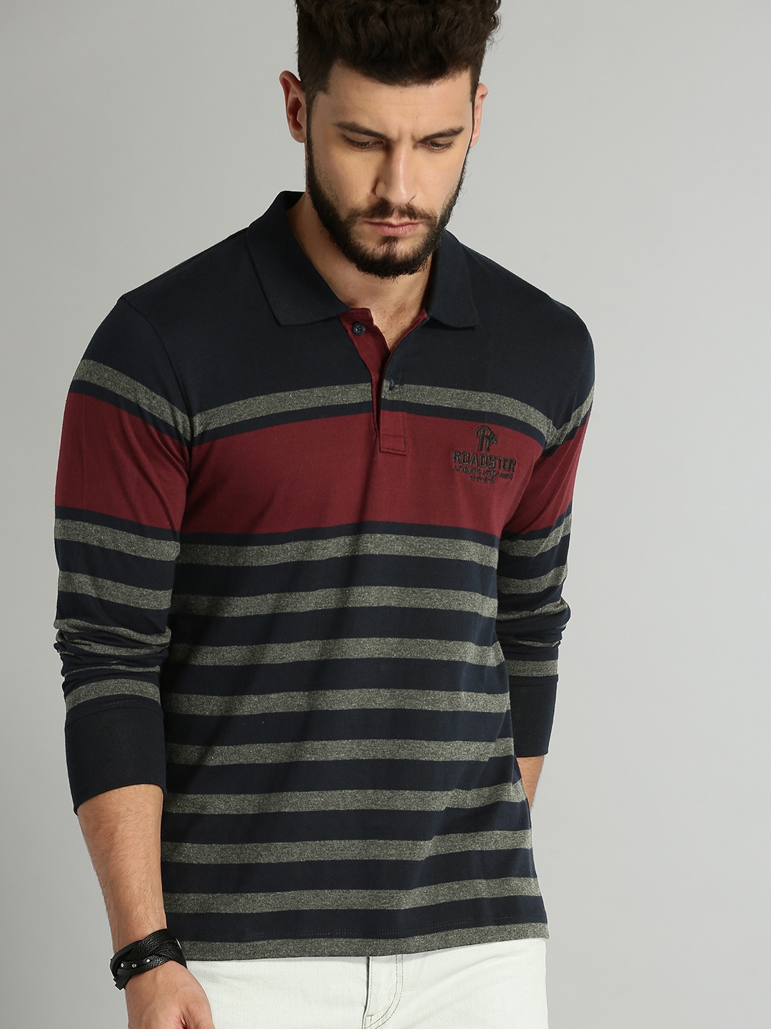 

Roadster Men Navy Blue Striped Polo T-shirt