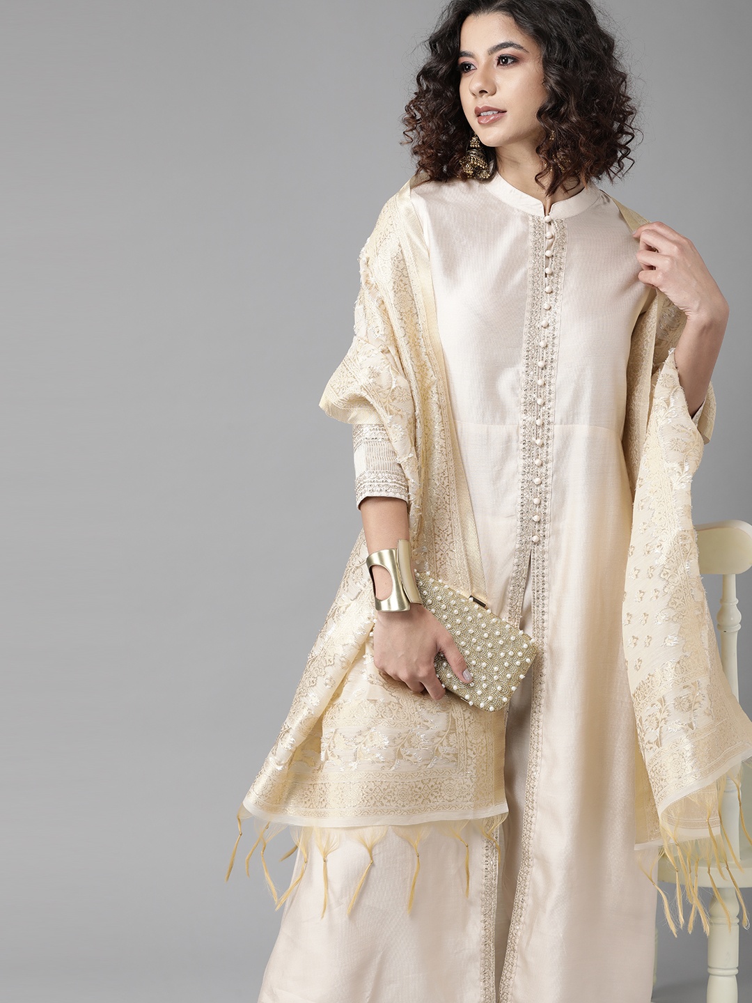 

Indo Era Trendy Off White Solid Kurta Set