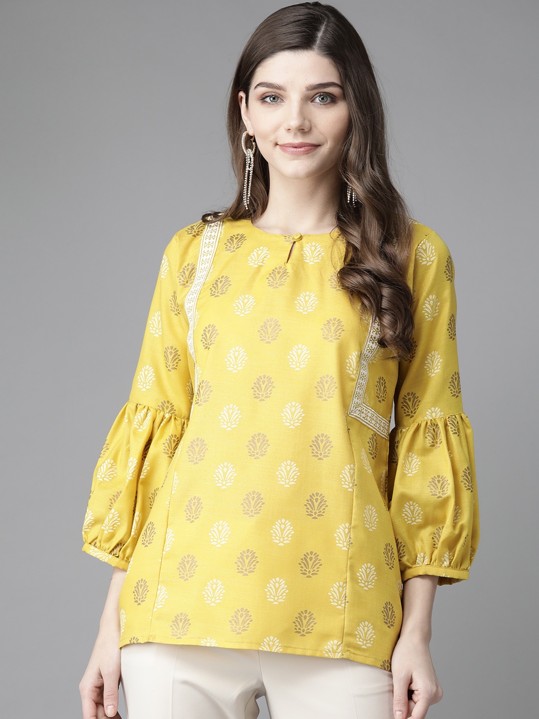 

Bhama Couture Mustard Yellow & Golden Keyhole Neck Puff Sleeves Block Print Regular Top