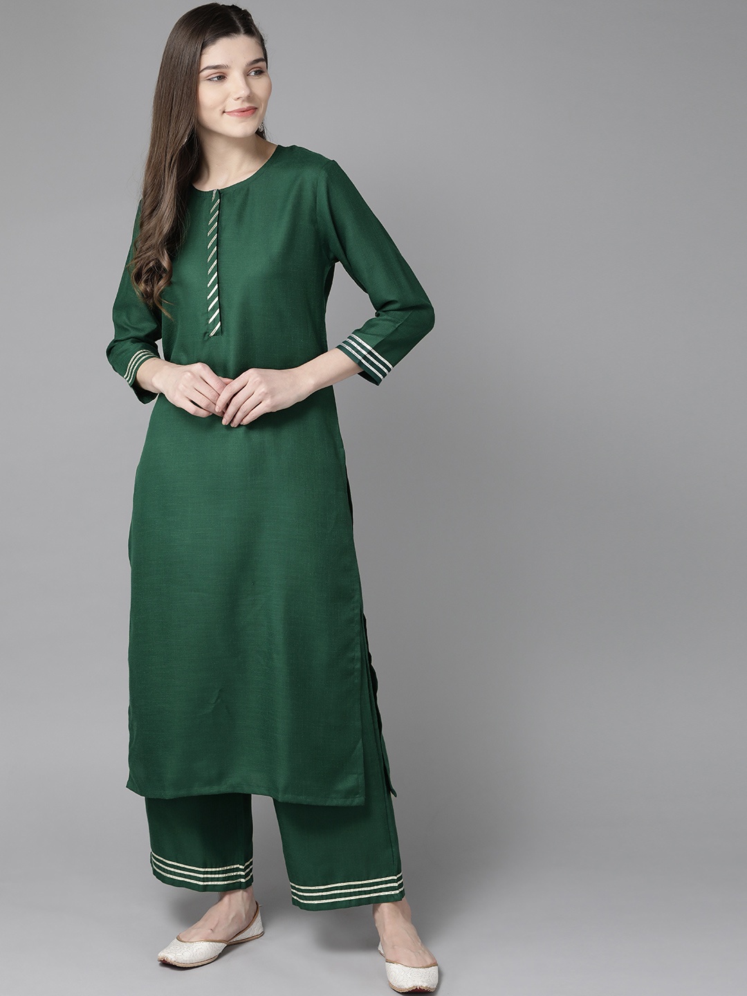 

Bhama Couture Women Green Solid Kurta with Palazzos