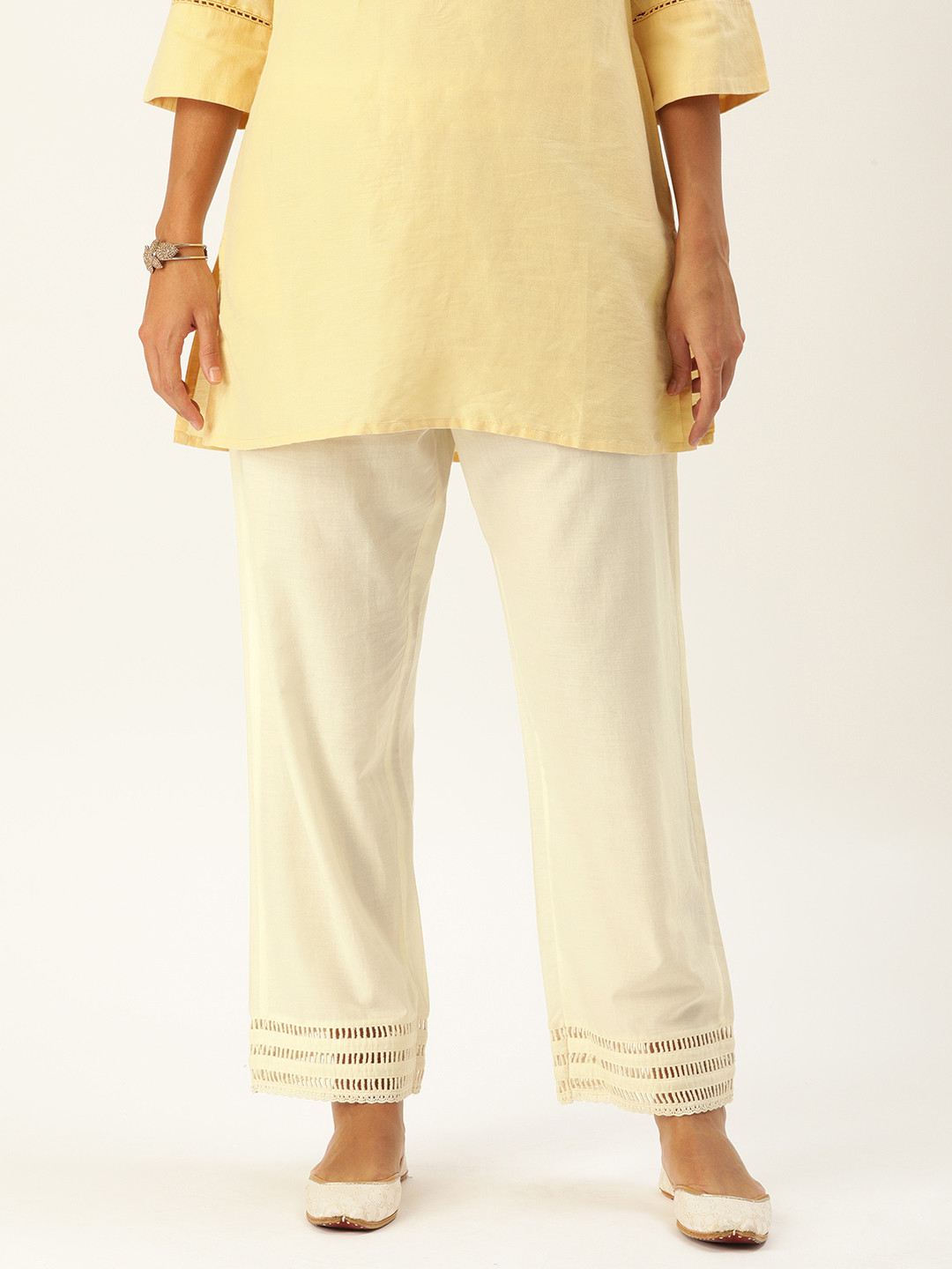

Varanga Women Off White Solid Regular Trousers