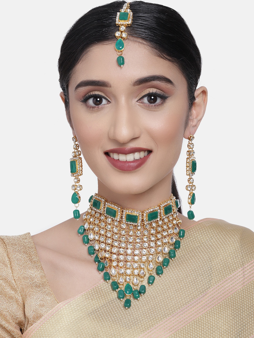 

Zaveri Pearls Gold-Toned & Green V-Shaped Ethnic Jewellery Set