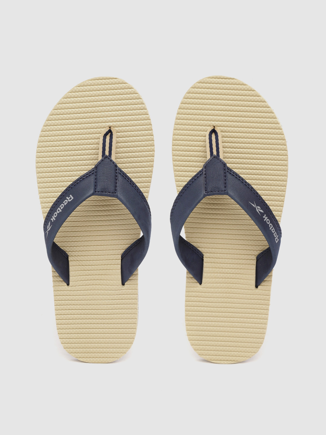

Reebok Men Navy Blue & Beige Striped & Textured Thong Flip-Flops