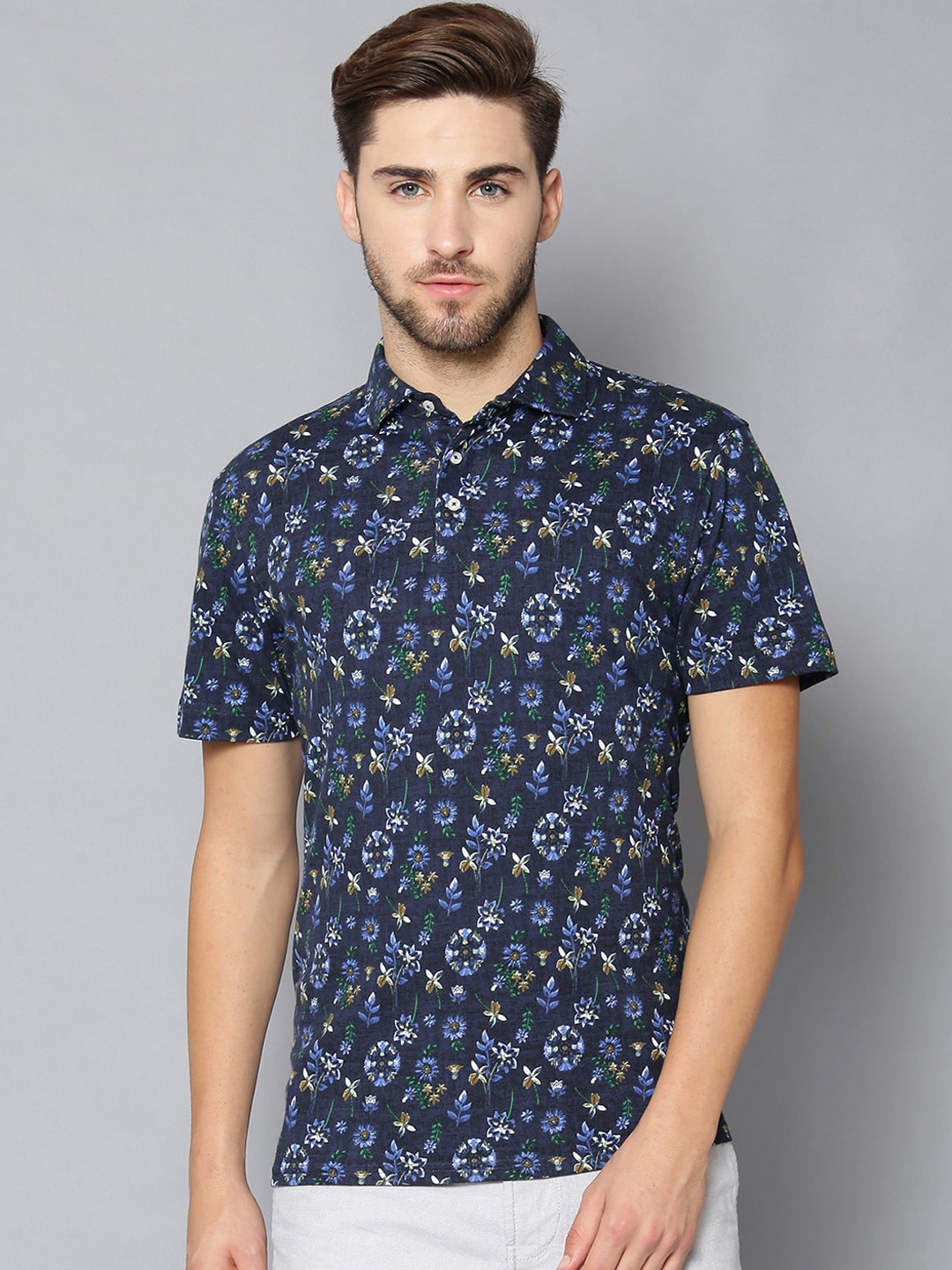 

Bruun & Stengade Men Navy Blue & Brown Floral Printed Polo Collar Cotton T-shirt