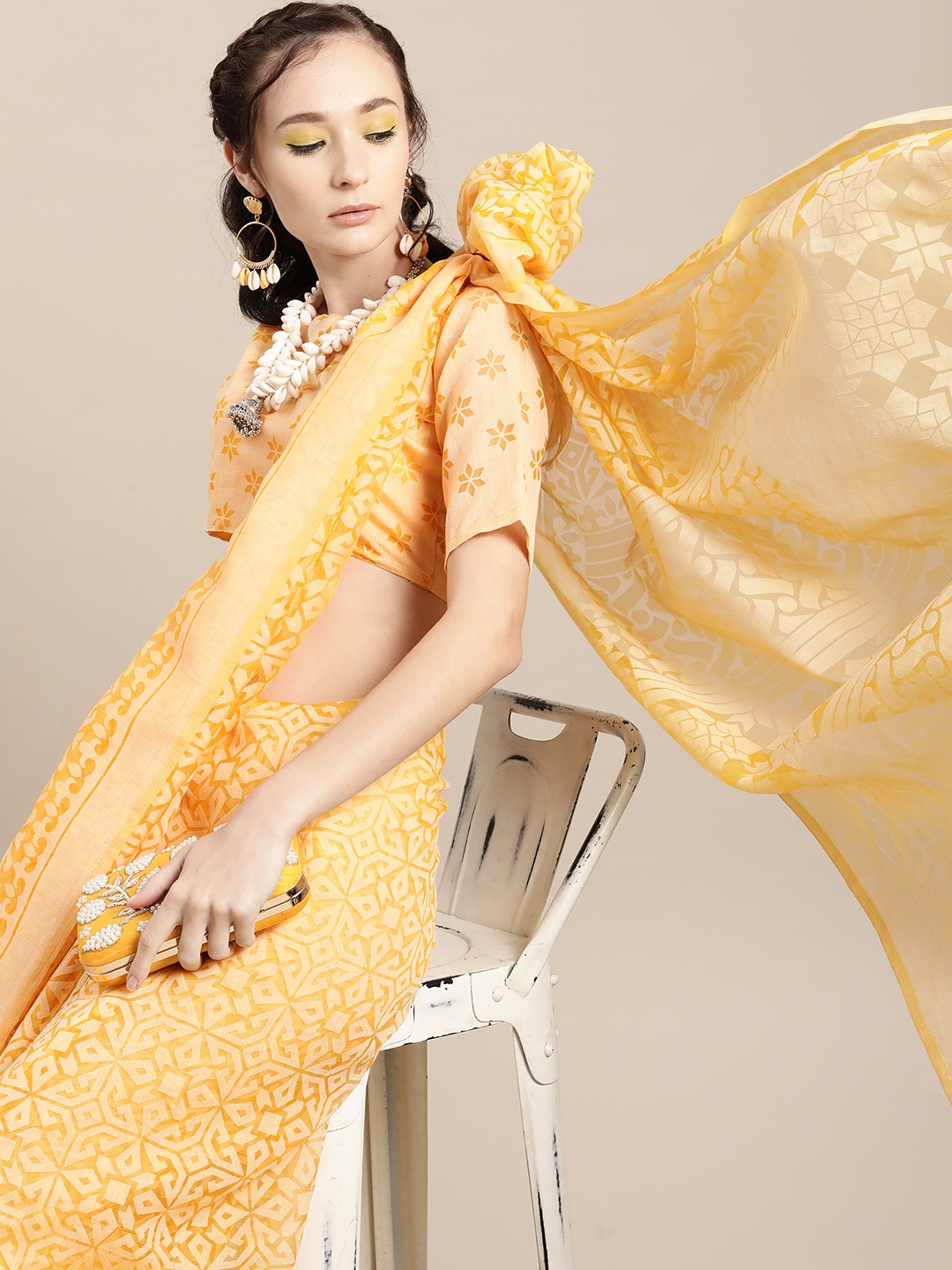 

Saree mall Ethnic Motifs Saree with Sleek border, Yellow