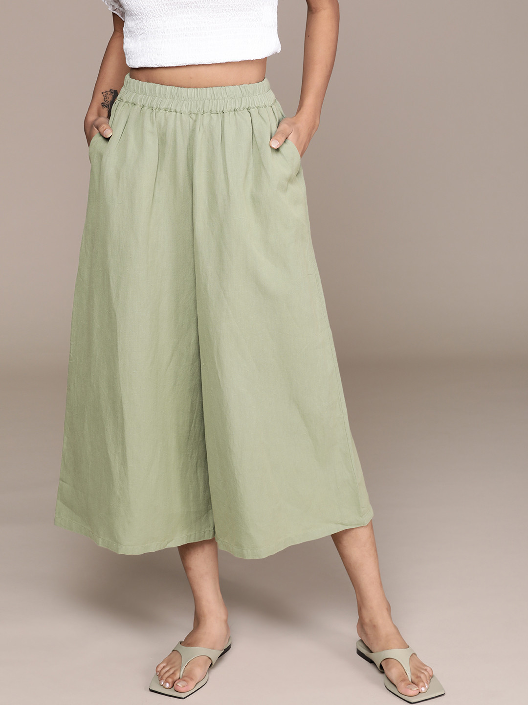 

Label Ritu Kumar Women Green Pure Cotton Solid Loose Fit Pleated Culottes Trousers