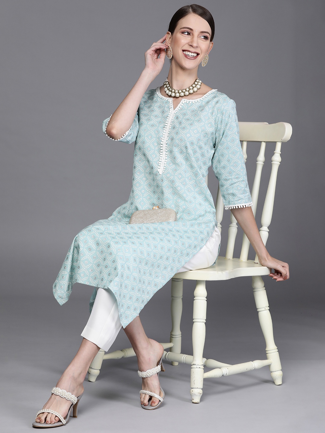

Libas Women Turquoise Blue & White Ethnic Motifs Printed Thread Work Kurta