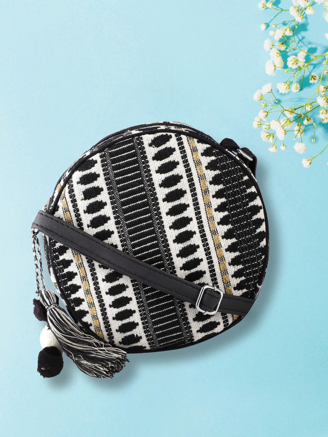 

Anouk Black & Off-White Ethnic Motifs Jacquard Self-Design Sling Bag with Tasselled Detail