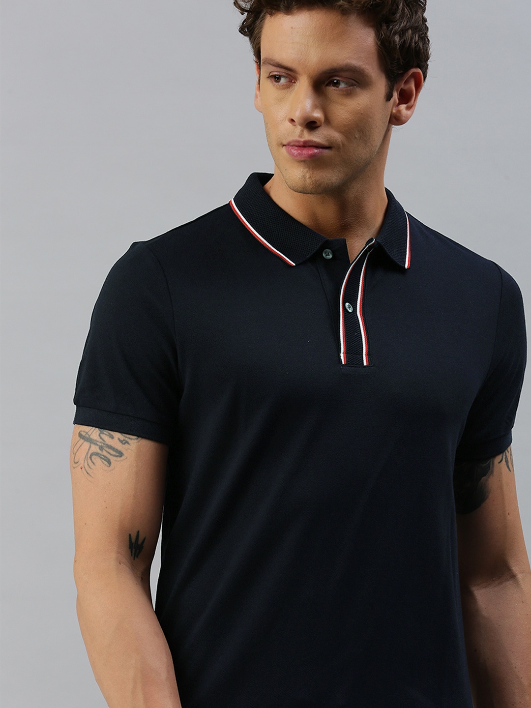 

Tommy Hilfiger Men Navy Blue Solid Polo Collar Pure Cotton T-shirt