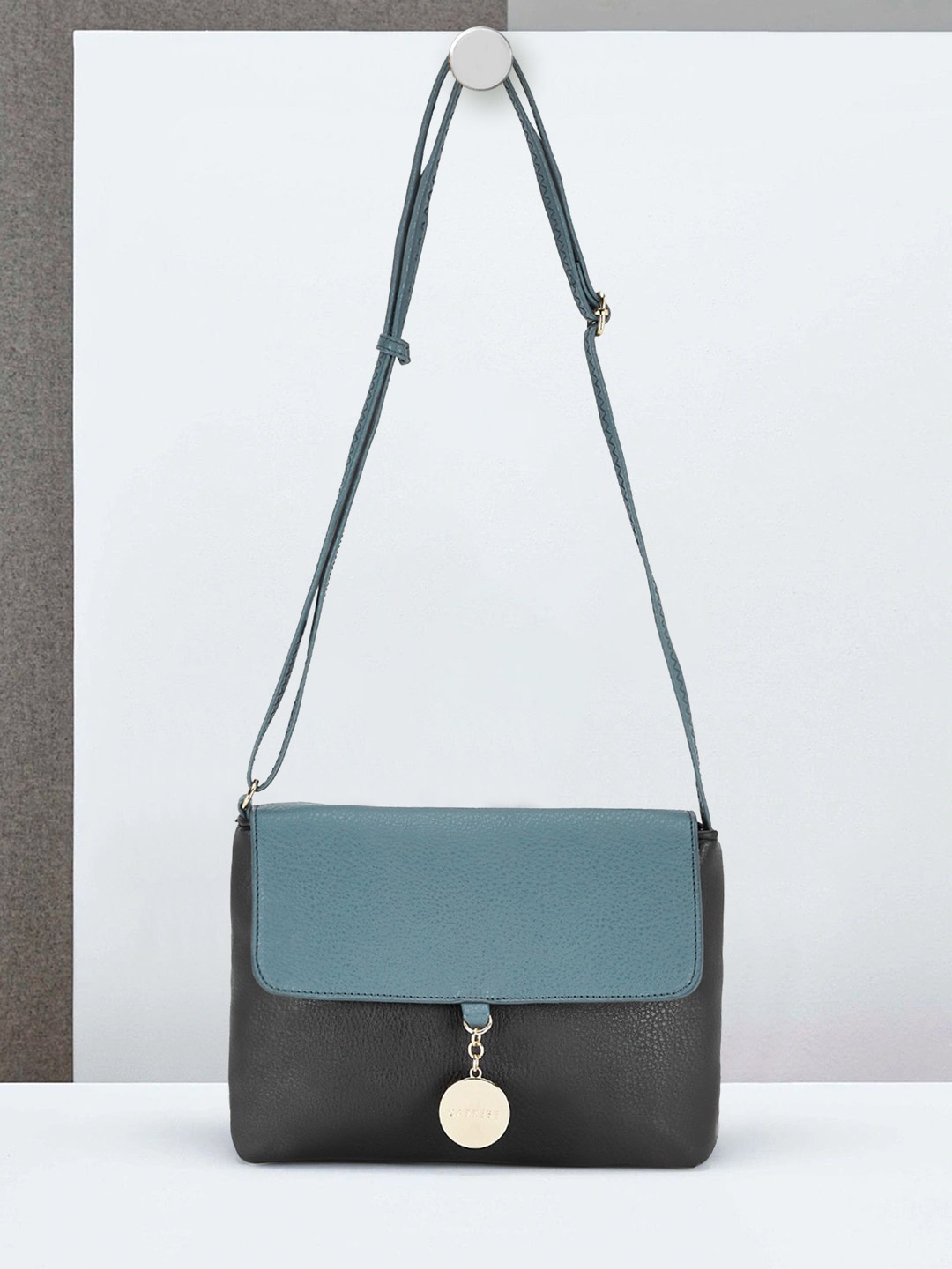 

Caprese Blue Colourblocked PU Structured Sling Bag