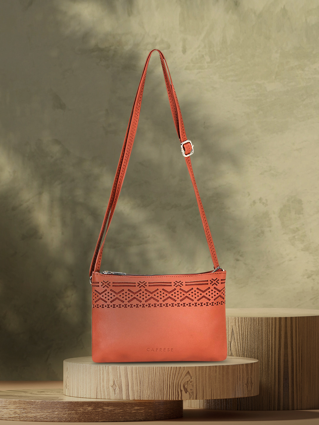 

Caprese Brown Textured PU Structured Sling Bag with Cut Work
