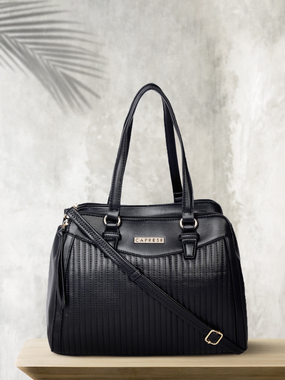 

Caprese Black Self Striped Shoulder Bag