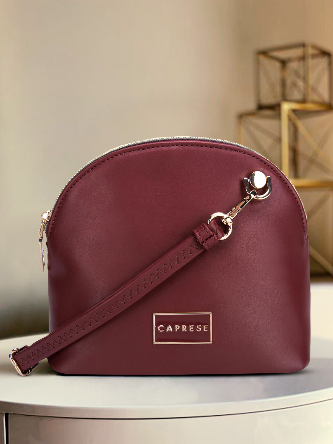 

Caprese Brown PU Structured Sling Bag