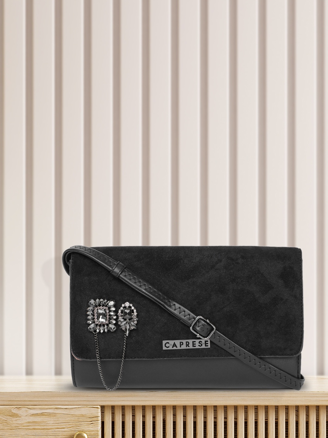 

Caprese Black Solid Suede Finish Sling Bag with Embellished Detail