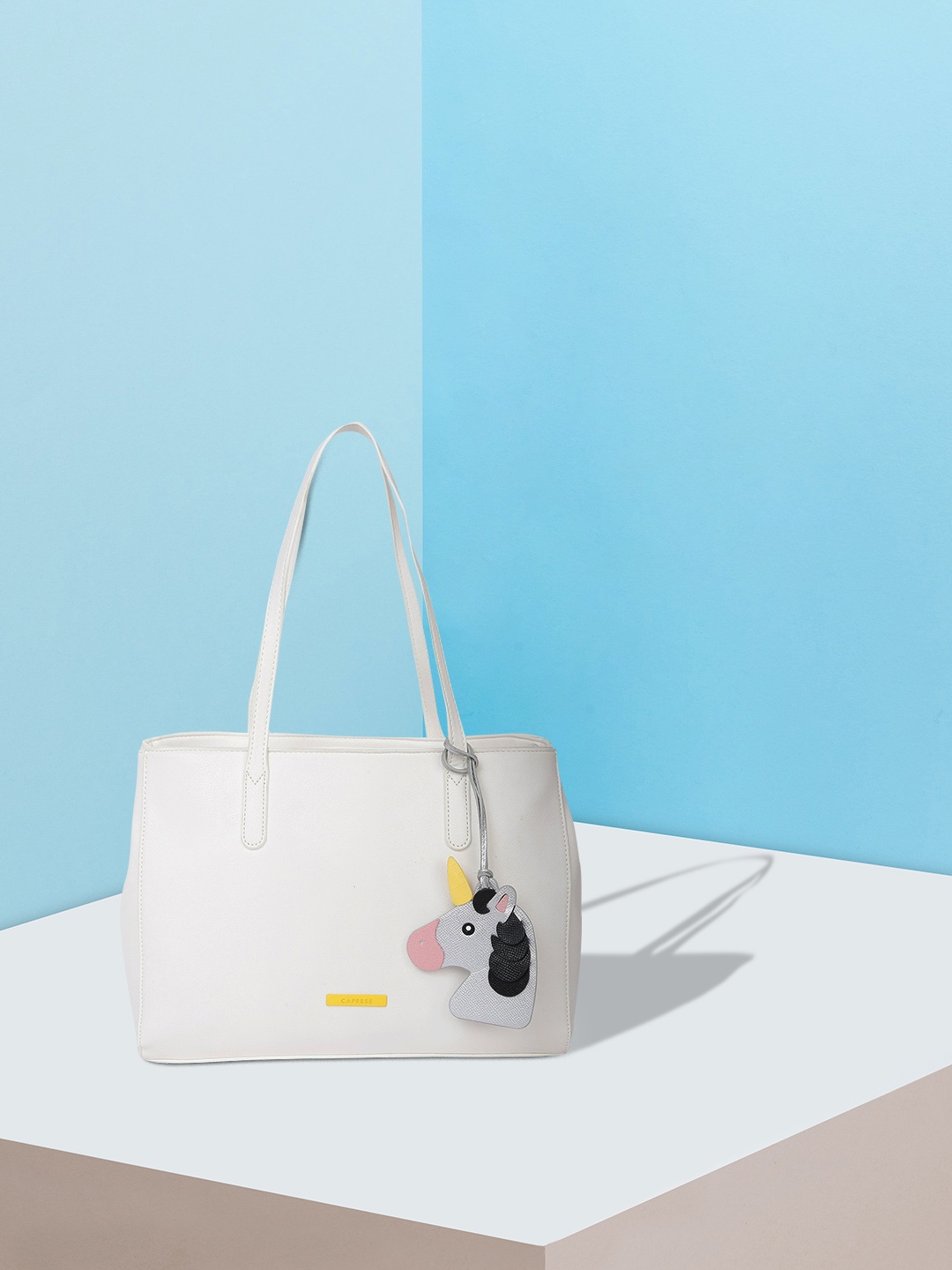 

Caprese White & Silver-Toned Solid Shoulder Bag with Unicorn Tab Detail